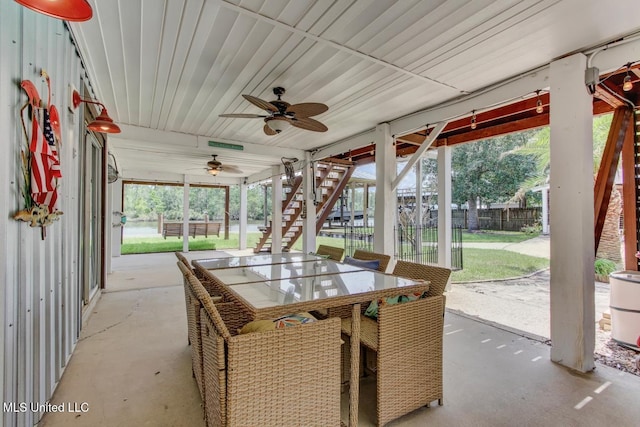 6085 Shawnee St, Kiln, MS 39556 - view of patio / terrace featuring ceiling fan, stairway, and outdoor dining area