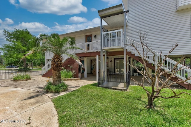 6085 Shawnee St, Kiln, MS 39556 - rear view of property with stairway and a patio area