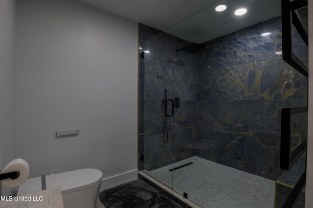 bathroom with toilet, a marble finish shower, and baseboards