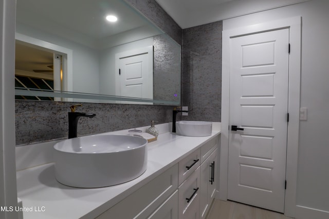 bathroom with double vanity and a sink