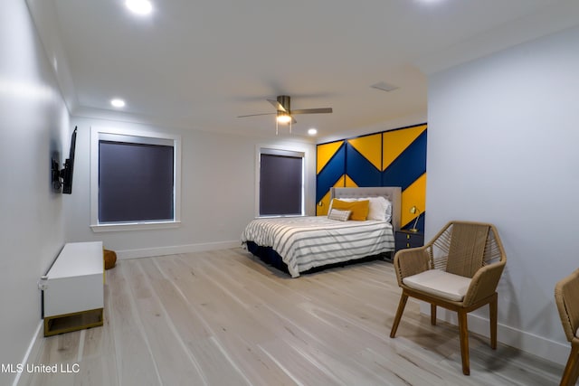 bedroom featuring light wood finished floors, recessed lighting, visible vents, ceiling fan, and baseboards