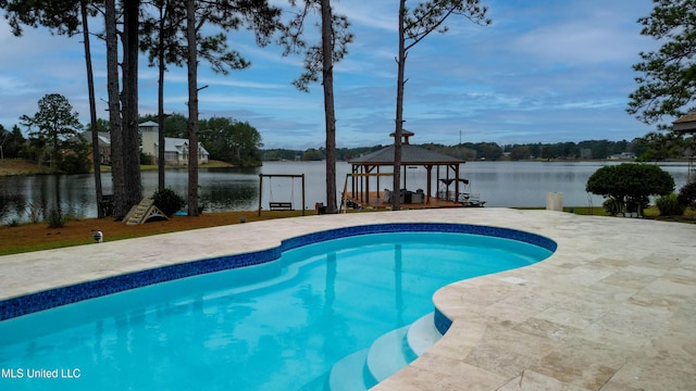 outdoor pool with a water view and a gazebo