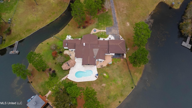 birds eye view of property with a water view