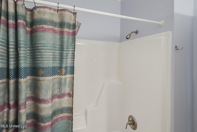1515 E Beach Blvd Unit 105, Pass Christian, MS 39571 - living room with crown molding, light tile patterned floors, baseboards, and a ceiling fan