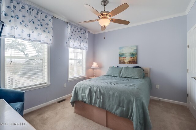 1515 E Beach Blvd Unit 105, Pass Christian, MS 39571 - bedroom featuring ornamental molding, light carpet, ceiling fan, and baseboards