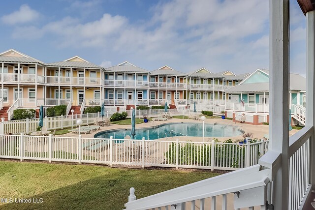 1515 E Beach Blvd Unit 105, Pass Christian, MS 39571 - pool with a patio, a residential view, and fence