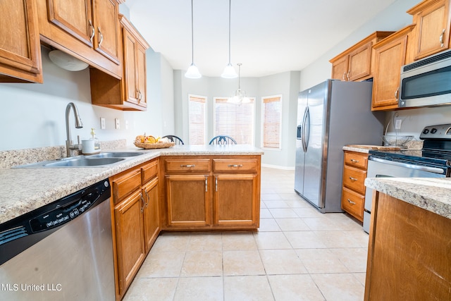 kitchen with an inviting chandelier, light tile patterned flooring, sink, pendant lighting, and stainless steel appliances