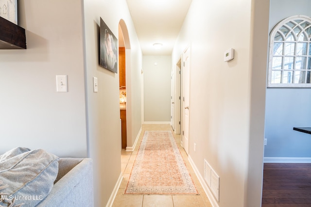 corridor featuring light wood-type flooring