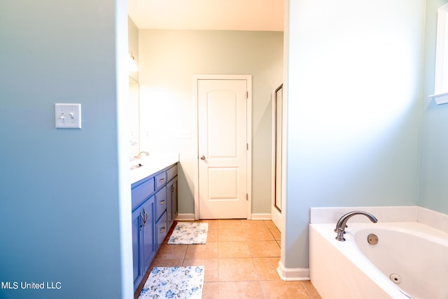 bathroom with vanity, independent shower and bath, and tile patterned flooring