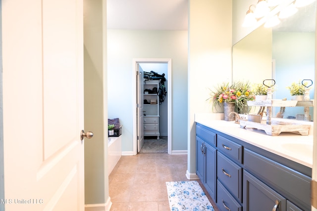 bathroom with vanity and tile patterned flooring