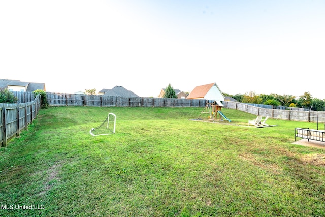 view of yard with a playground