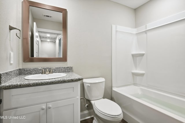 full bathroom with shower / washtub combination, vanity, and toilet