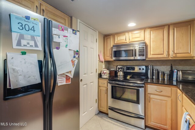 2046 Beach Blvd Unit 321, Biloxi, MS 39531 - kitchen with light tile patterned floors, recessed lighting, appliances with stainless steel finishes, and light brown cabinetry