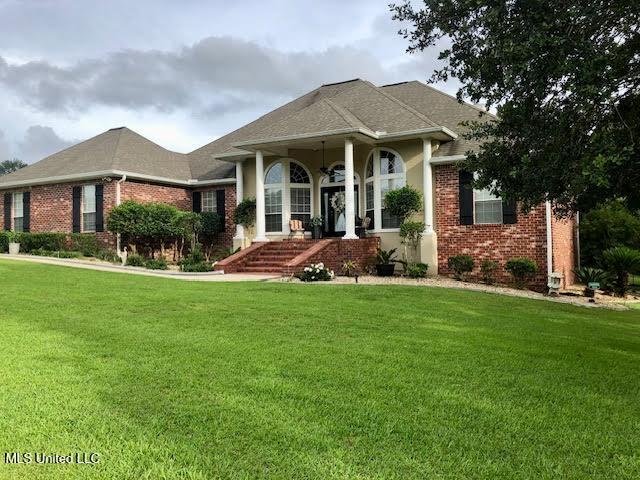 4 Mitchell Cv, Carriere, MS 39426 - view of front of property with a front lawn and brick siding