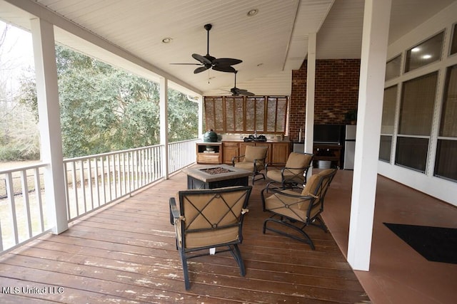 4 Mitchell Cv, Carriere, MS 39426 - wooden deck with an outdoor kitchen, an outdoor fire pit, and ceiling fan