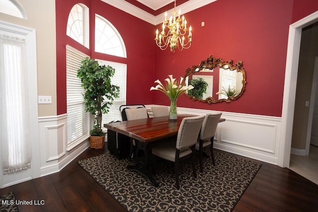4 Mitchell Cv, Carriere, MS 39426 - dining space featuring wood finished floors, a chandelier, crown molding, wainscoting, and plenty of natural light