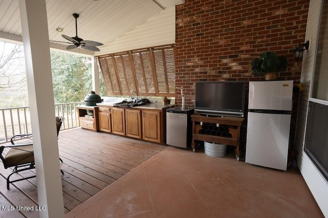 4 Mitchell Cv, Carriere, MS 39426 - wooden terrace with area for grilling, ceiling fan, and a sink