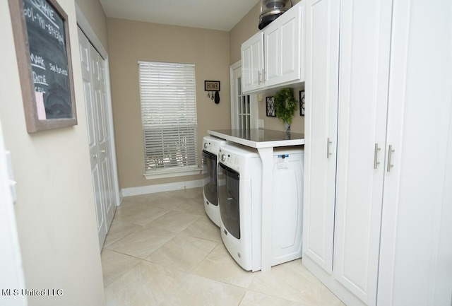 4 Mitchell Cv, Carriere, MS 39426 - laundry room with cabinet space, washer and dryer, light tile patterned floors, and baseboards