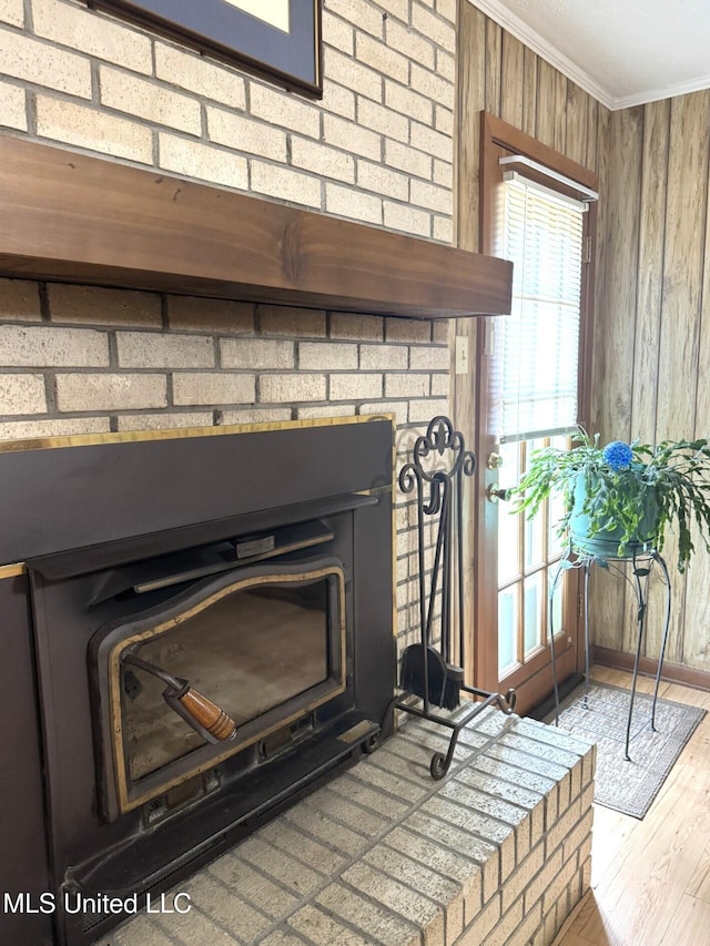 25 Cloverdale Rd, Natchez, MS 39120 - detailed view of crown molding, wood walls, wood finished floors, and a fireplace