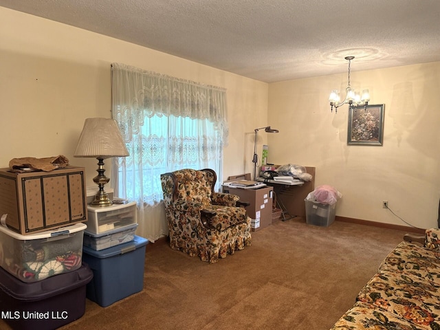 25 Cloverdale Rd, Natchez, MS 39120 - sitting room with carpet floors, a textured ceiling, and a chandelier