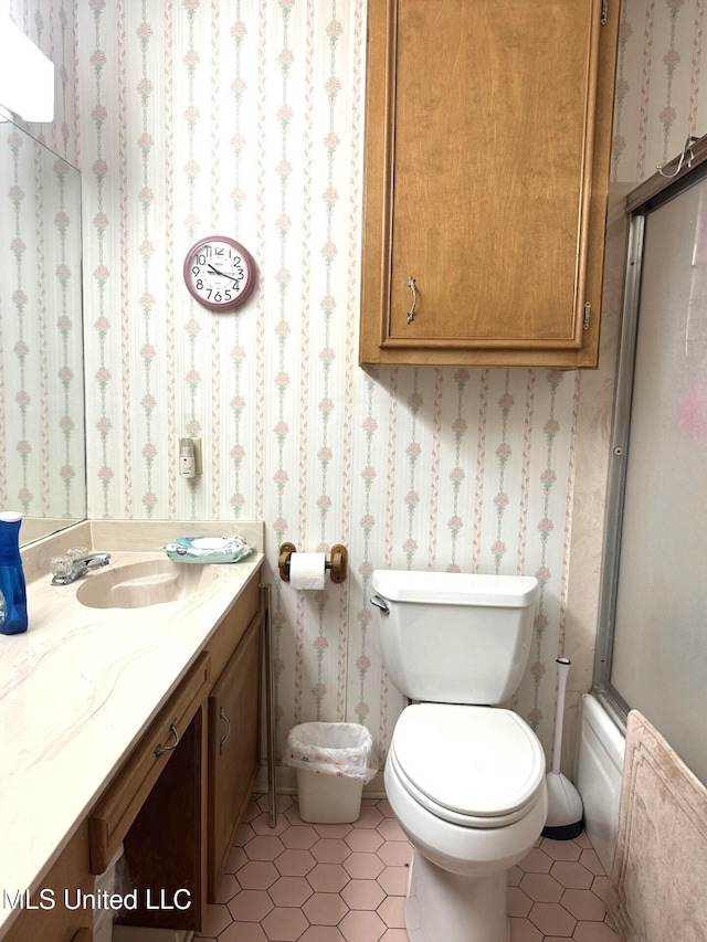 25 Cloverdale Rd, Natchez, MS 39120 - bathroom with tile patterned floors, vanity, toilet, and wallpapered walls