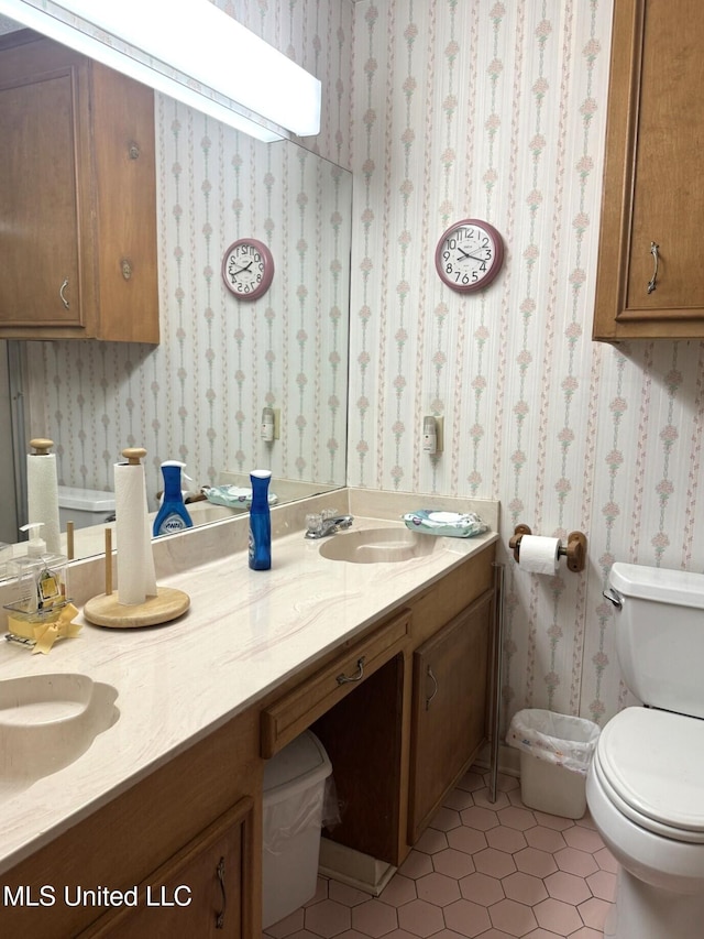 25 Cloverdale Rd, Natchez, MS 39120 - bathroom featuring double vanity, tile patterned floors, and toilet