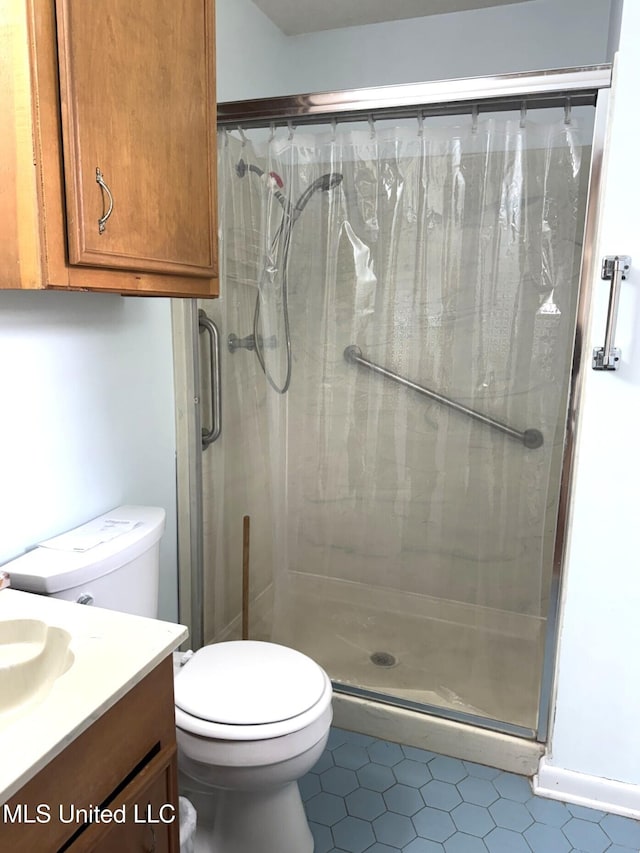 25 Cloverdale Rd, Natchez, MS 39120 - full bathroom with tile patterned flooring, a stall shower, toilet, and vanity