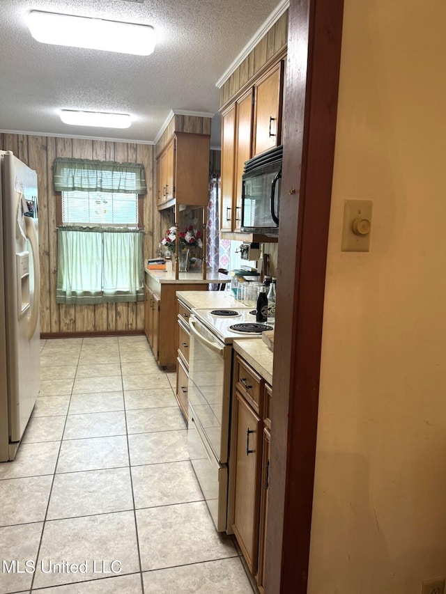 25 Cloverdale Rd, Natchez, MS 39120 - kitchen featuring white appliances, light countertops, a textured ceiling, crown molding, and brown cabinetry