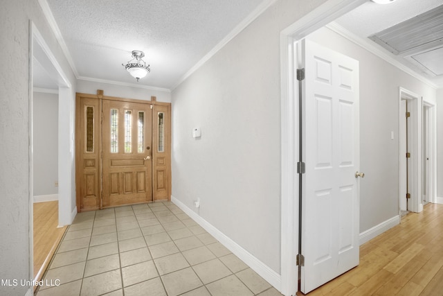 429 Linda Dr, Biloxi, MS 39531 - foyer featuring crown molding, a textured ceiling, and light wood finished floors