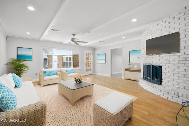 429 Linda Dr, Biloxi, MS 39531 - living room featuring light wood-type flooring, ceiling fan, beam ceiling, a fireplace, and recessed lighting