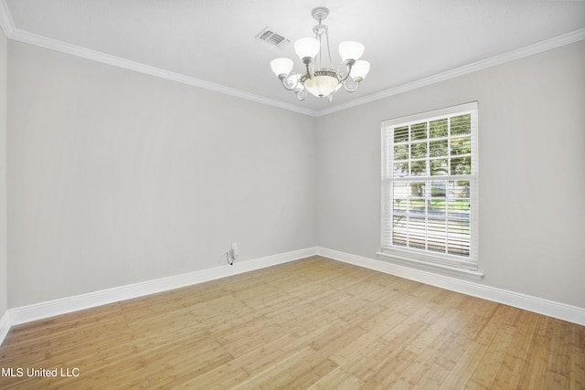 429 Linda Dr, Biloxi, MS 39531 - empty room with a chandelier, light wood-type flooring, and crown molding