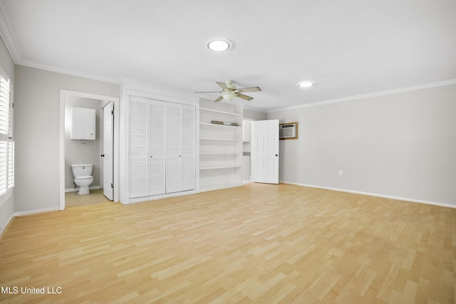 429 Linda Dr, Biloxi, MS 39531 - unfurnished bedroom with ornamental molding, light wood finished floors, an AC wall unit, recessed lighting, and ensuite bathroom