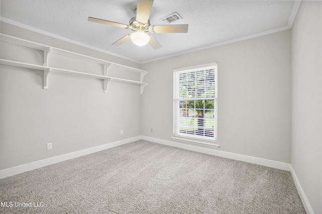 429 Linda Dr, Biloxi, MS 39531 - empty room featuring light carpet, a ceiling fan, ornamental molding, and a textured ceiling