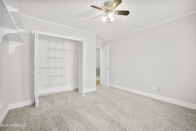 429 Linda Dr, Biloxi, MS 39531 - unfurnished bedroom with carpet floors, crown molding, a closet, and ceiling fan