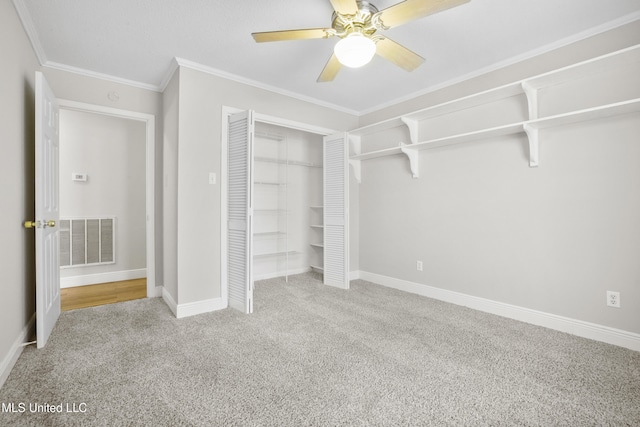 429 Linda Dr, Biloxi, MS 39531 - unfurnished bedroom featuring carpet flooring, crown molding, a closet, and a ceiling fan