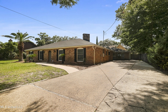 429 Linda Dr, Biloxi, MS 39531 - view of front facade with a chimney, concrete driveway, and brick siding