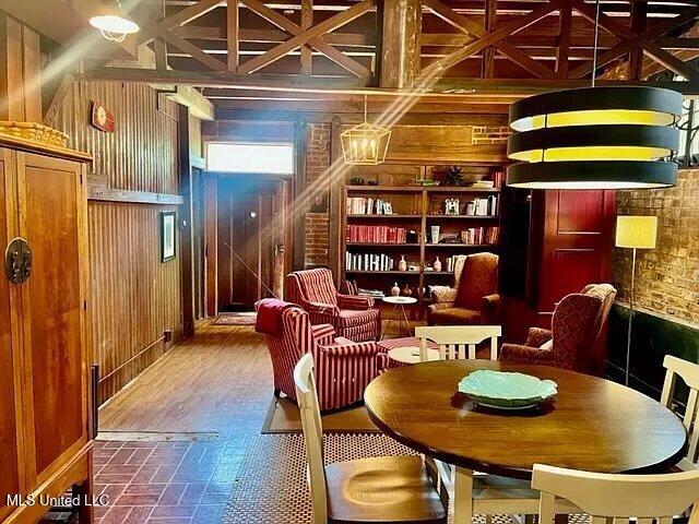 sitting room featuring wood walls