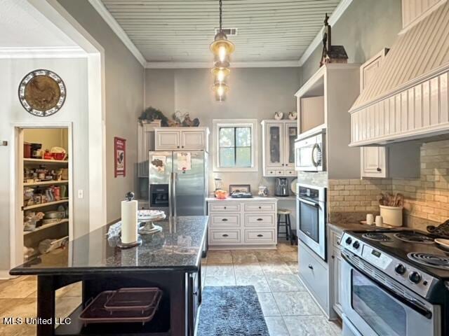 kitchen featuring appliances with stainless steel finishes, decorative backsplash, white cabinetry, and ornamental molding