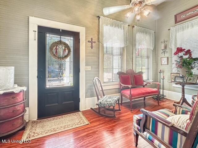 entryway with ceiling fan, wood-type flooring, and plenty of natural light