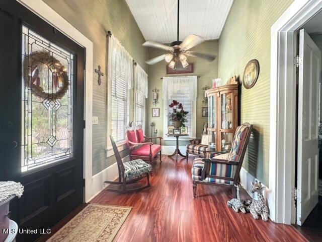 interior space with wood-type flooring and ceiling fan