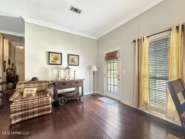 interior space with ornamental molding and dark hardwood / wood-style flooring