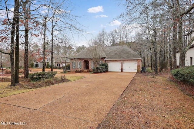 view of front facade with a garage, concrete driveway, brick siding, and roof with shingles