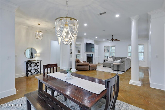 dining room with ceiling fan with notable chandelier, decorative columns, tile patterned flooring, crown molding, and built in shelves