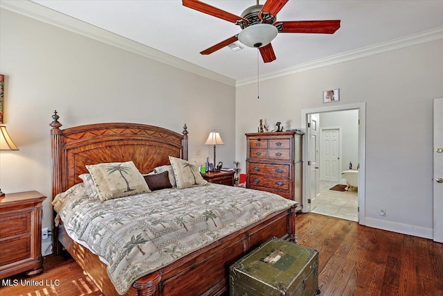 bedroom with wood finished floors, baseboards, ceiling fan, ornamental molding, and ensuite bathroom