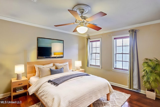 bedroom with a ceiling fan, crown molding, baseboards, and wood finished floors