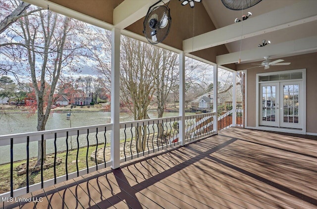 wooden terrace featuring a ceiling fan and french doors