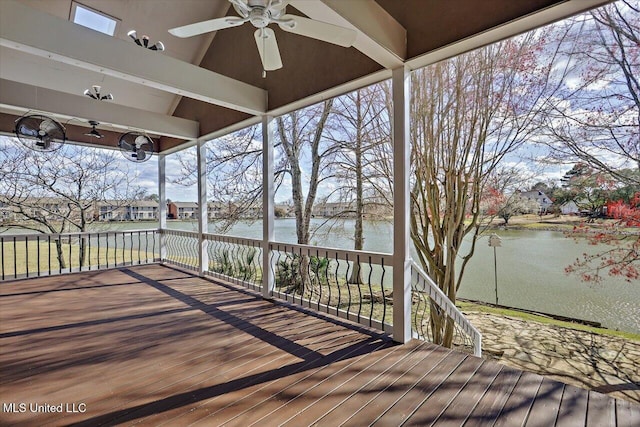 wooden deck featuring a water view and a ceiling fan