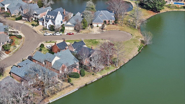 drone / aerial view with a residential view and a water view