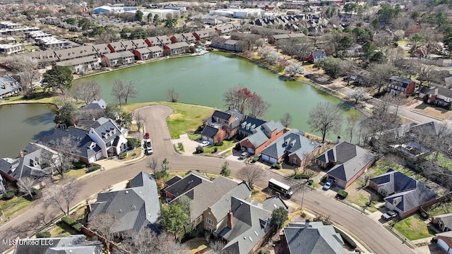 drone / aerial view with a residential view and a water view