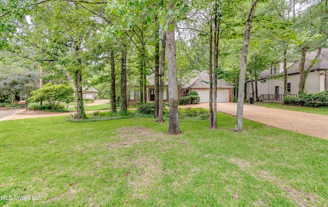 1025 Monet Cv, Brandon, MS 39047 - view of front of house featuring driveway, a front yard, and a garage